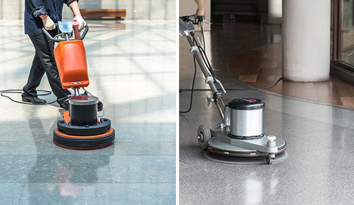 A polished hotel common area featuring clean marble-style tile floors and designer lounge seating.